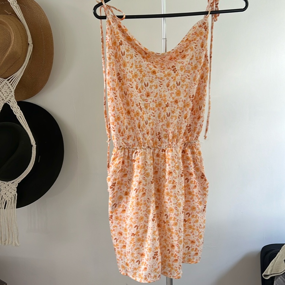 Orange floral romper. Never worn.
